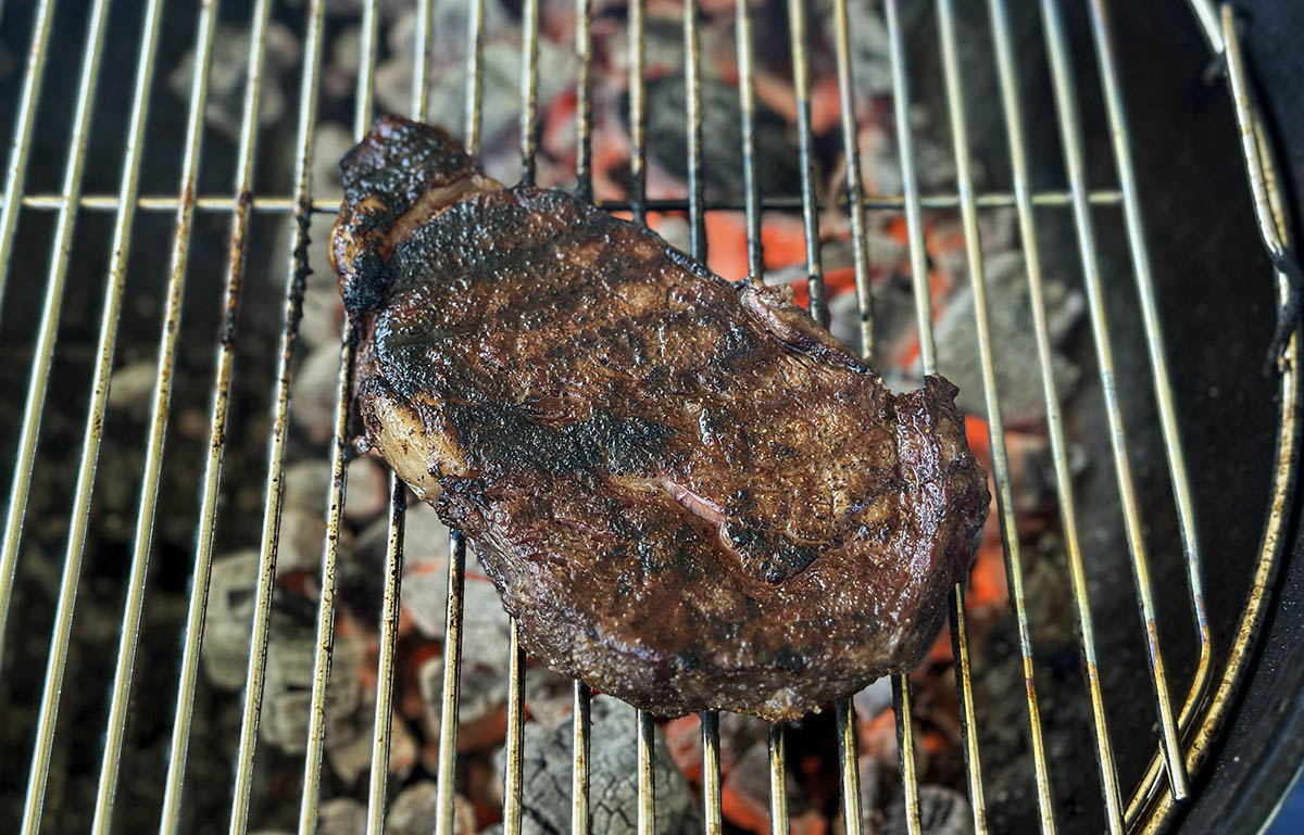 steak on charcoal grill