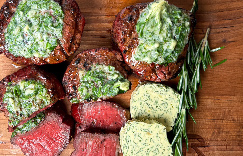 sliced steak with herb compound butter