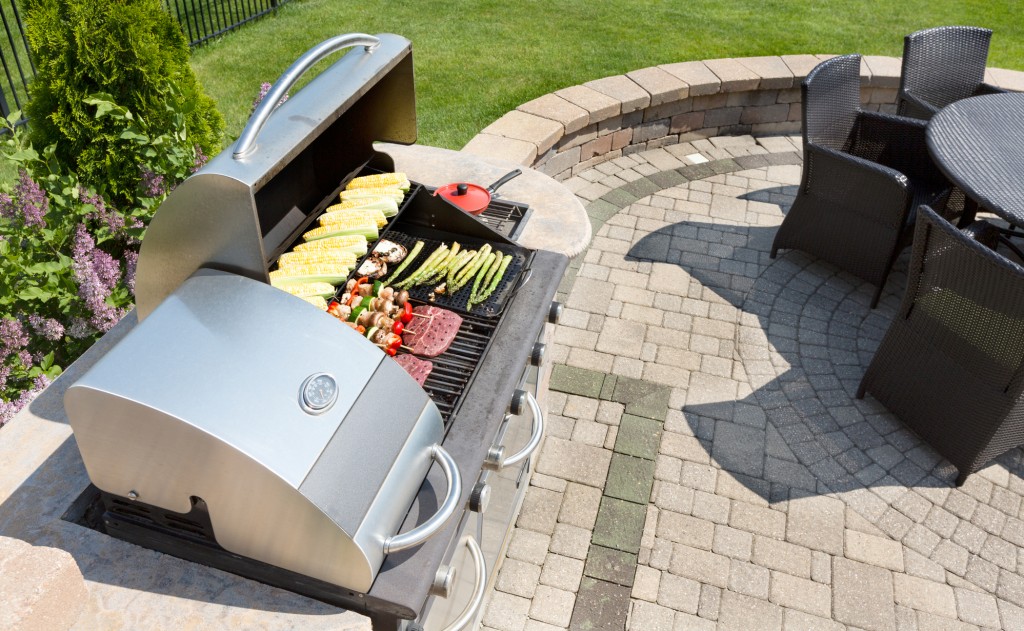 Outdoor high-end grill on a brick patio