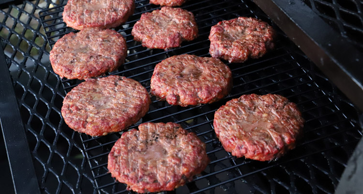 burger patties on a grill