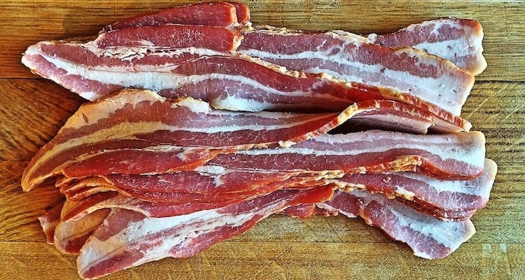 bacon strips on a wooden background