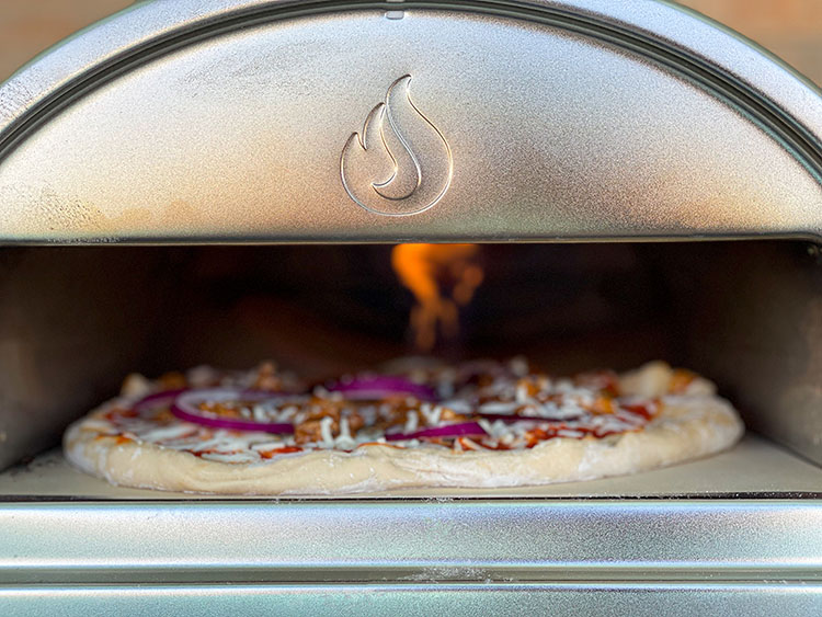 gozney roccbox oven with pizza cooking