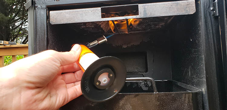 Igniting charcoal with butane torch
