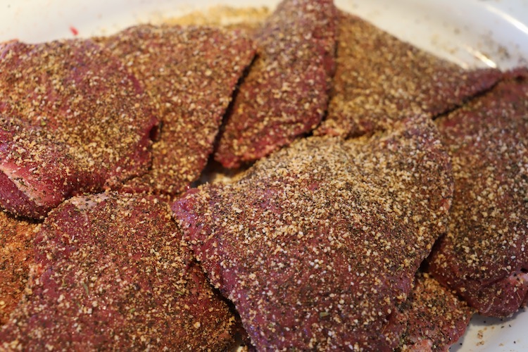 raw beef cheeks with a rub 