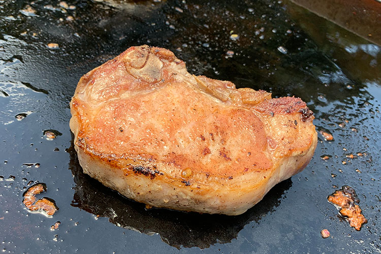 cooked Berkshire pork chop on a griddle