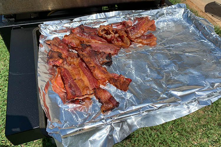 cooked bacon on a foil