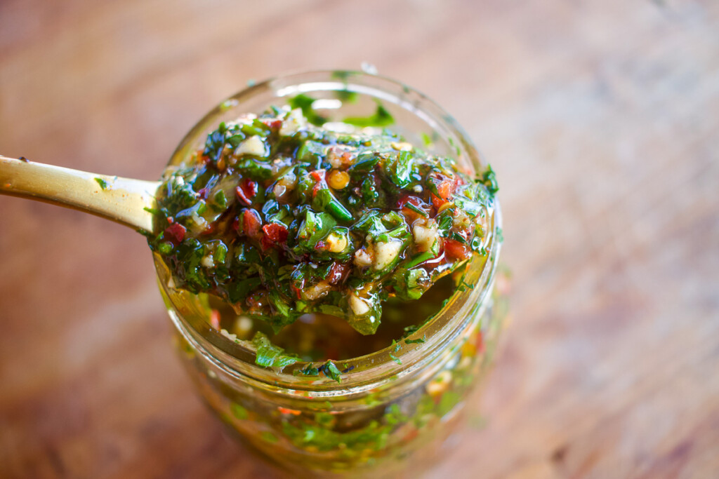 a jar of chimchuri looking down on a spoonful 