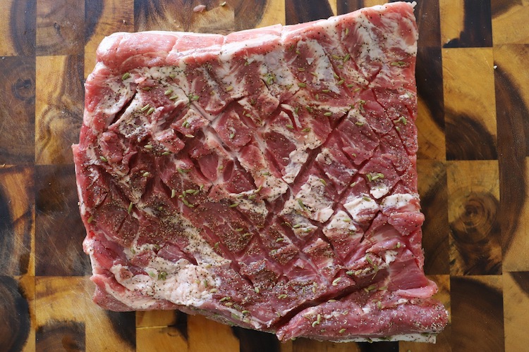 uncooked pork belly sliced with crosshatch pattern