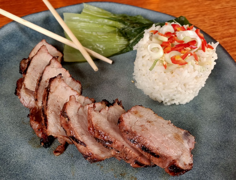 Char Siu pork with Jasmine rice and steamed greens on a plate