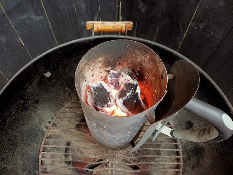 charcoal chimney with lit charcoal