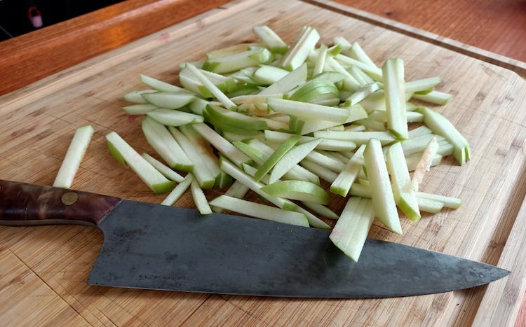 sliced apples on a wooden board