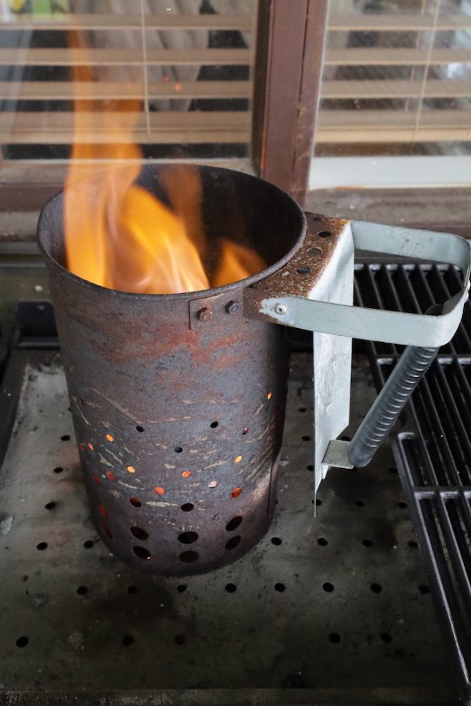 charcoal chimney with burning charcoal