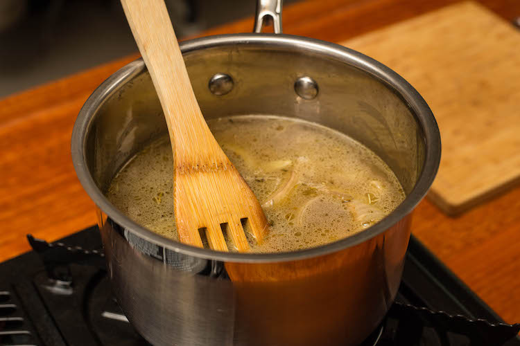 onions and chicken stock in a saucepan 
