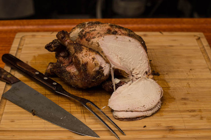 sliced chicken on a wooden board