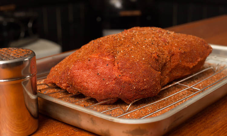 pork butt covered in pork rub
