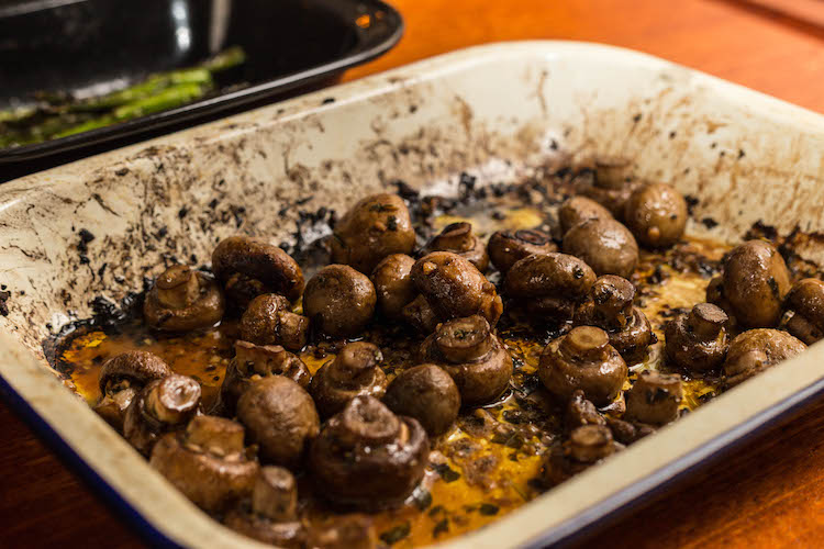 butter garlic mushrooms in a baking tray