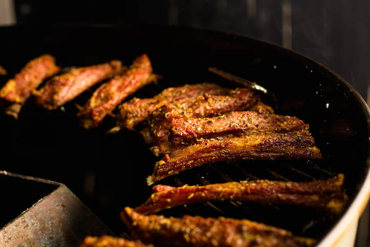 cooked lamb ribs on a grill