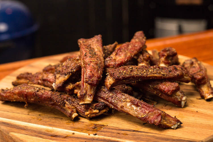 grilled lamb ribs on a wooden board