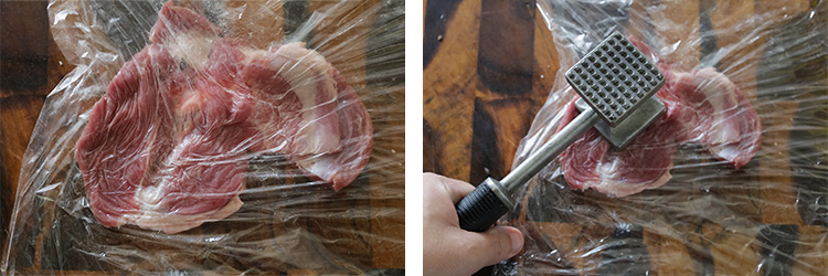 a piece of lamb shoulder under the food wrap on a wooden board