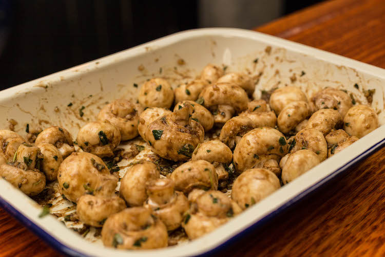 white button mushrooms covered in butter garlic seasoning