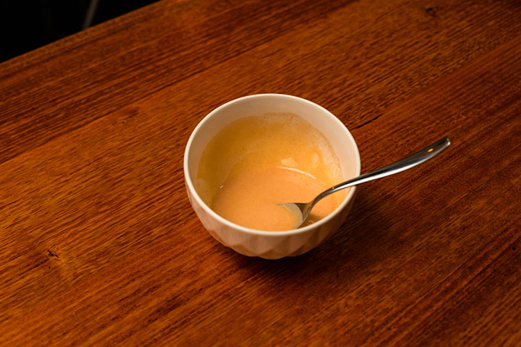 creamy hot sauce in a bowl with a spoon
