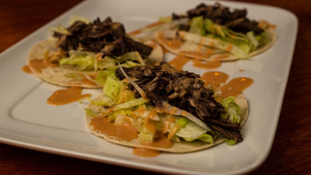 pulled beef tacos with creamy hot sauce