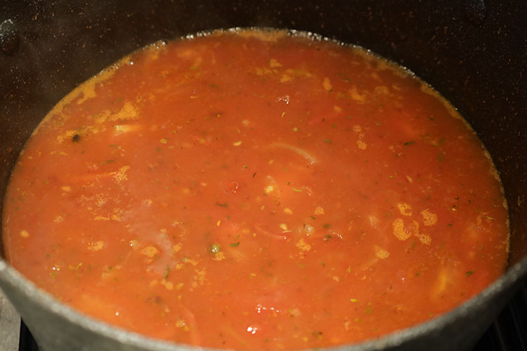 consomme cooking in a pot
