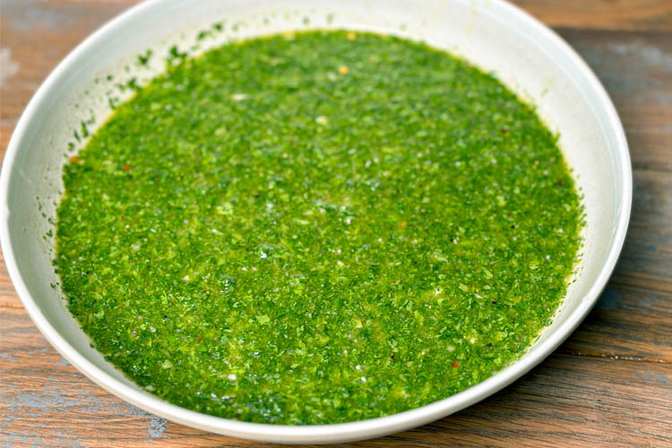 chimichurri sauce in a white bowl