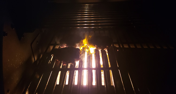 steaks on a grill