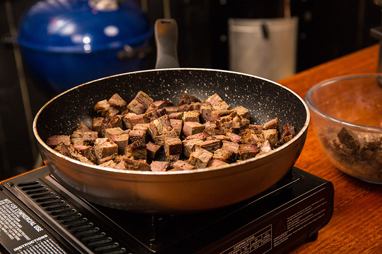 diced brisket in a frying pan