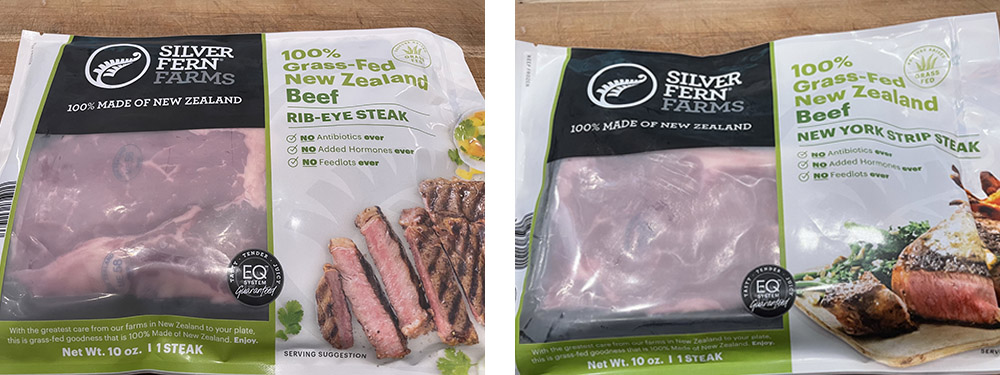 packaged rib eye and new york strip steaks from silver fern farms on a wooden table