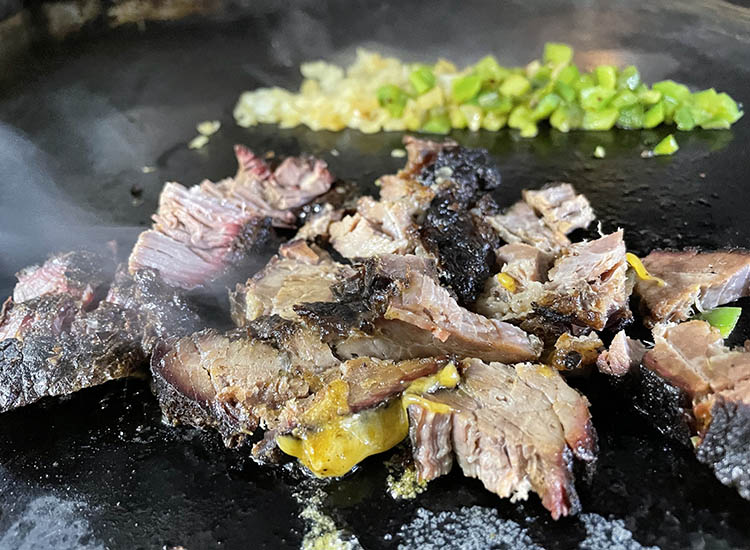 diced brisket on a griddle