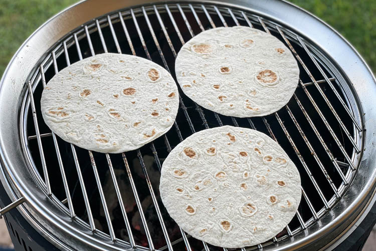 three tortillas on the grill