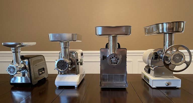 selection of meat grinders on a table