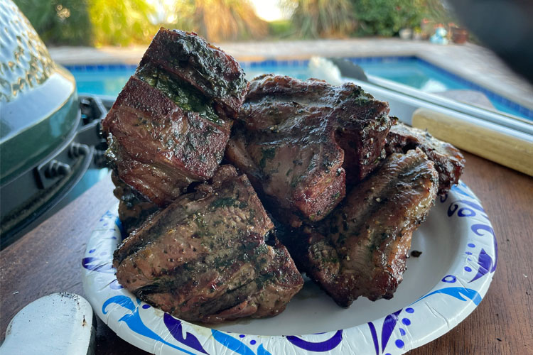 cooked lamb chops on a blue and white plate