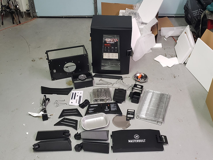 Masterbuilt MPS 340/G smoker unassembled parts pn the floor