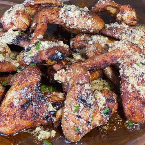 cooked garlic, butter, parmesan wings on a plate