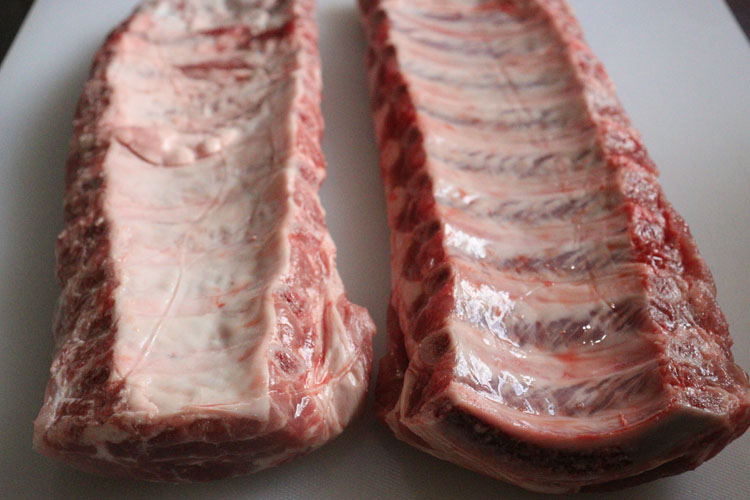 raw baby back ribs bone side up