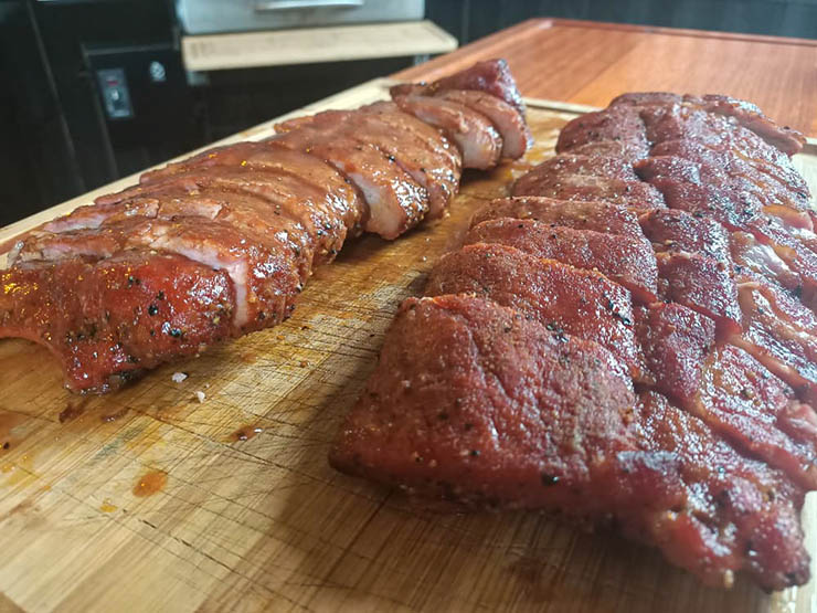 smoked pork ribs on a wooden board