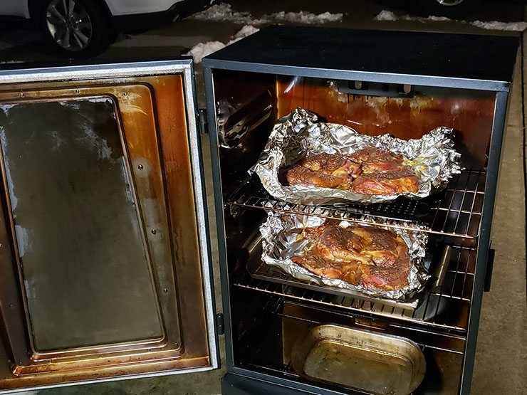 meat smoking inside the Masterbuilt MPS 340/G propane smoker