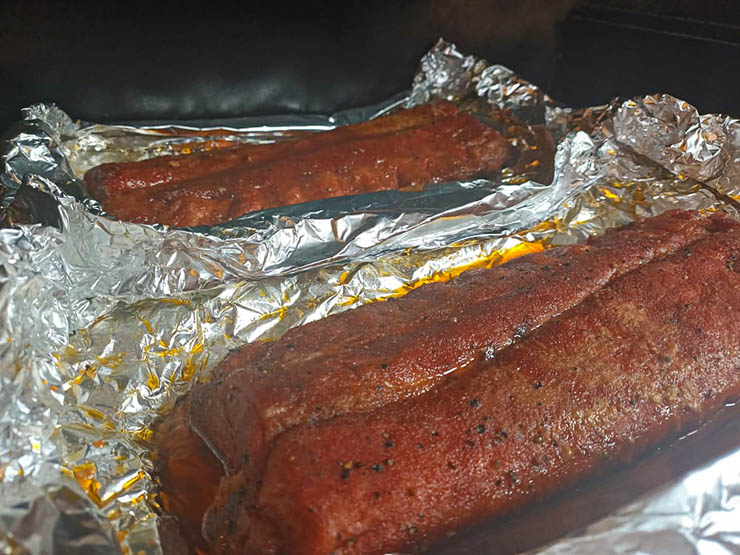 baby back pork ribs smoking in foil