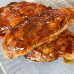 cooked nashville hot grilled chicken on a plate