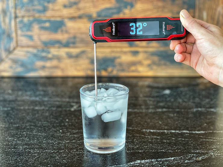 fireboard spark temperature probe inside a glass filled with ice water