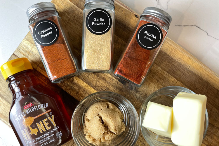 sauce ingredients laid out on wooden chopping board