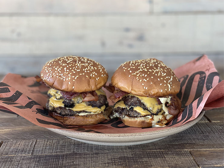 two big mac smash burgers on a plate