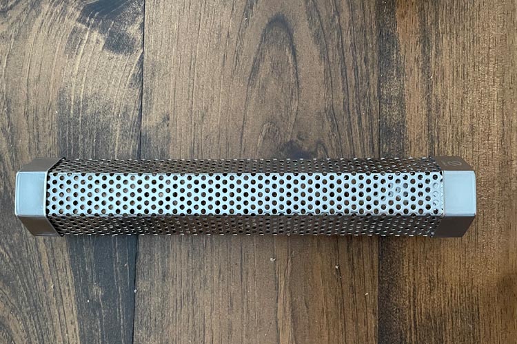 smoke tube, unlit, on wooden board