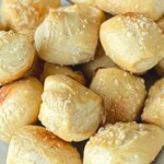 a close up shot of smoked pretzel bites on a white plate