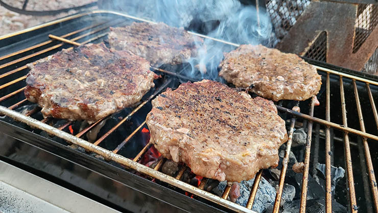 burger patties on the grill