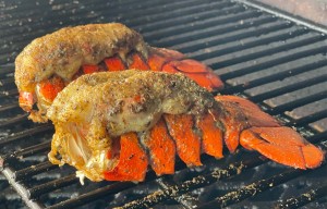 cooked smoked lobster tails on the grill