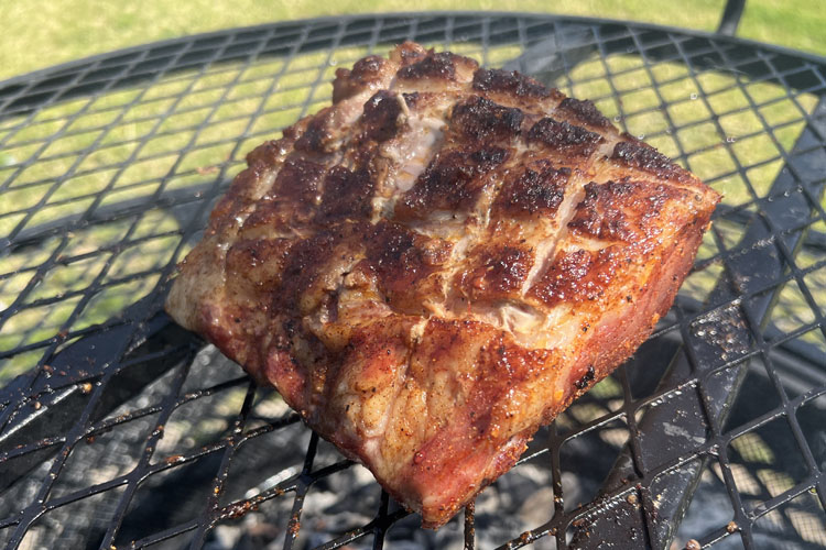 loin of pork on the grill skin side up